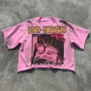 Flat lay of custom rhinestone distressed t-shirt showing oversized fit and raw hem.