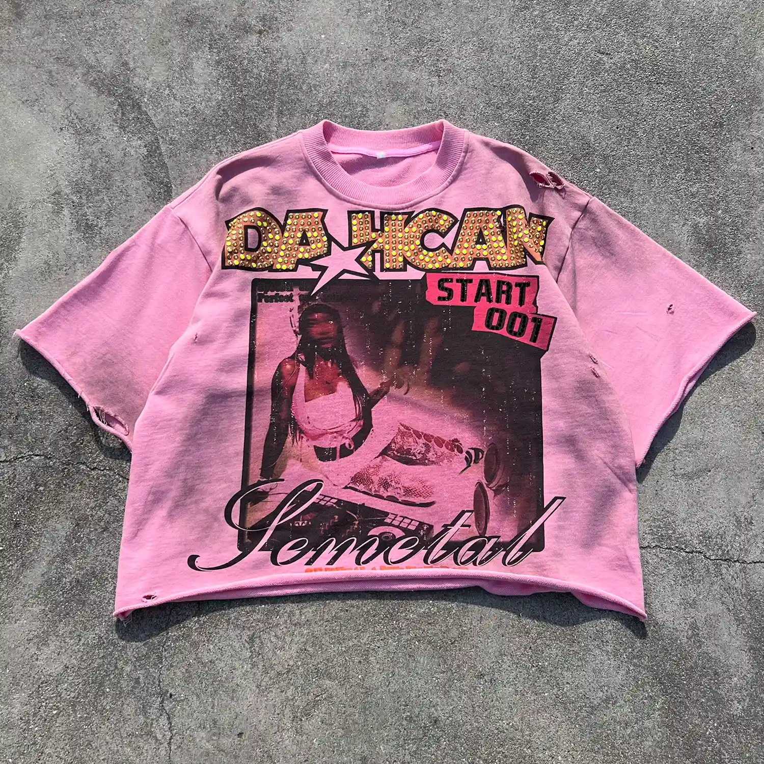 Wide flat lay showing the drop shoulder cut of the custom rhinestone distressed t-shirt.